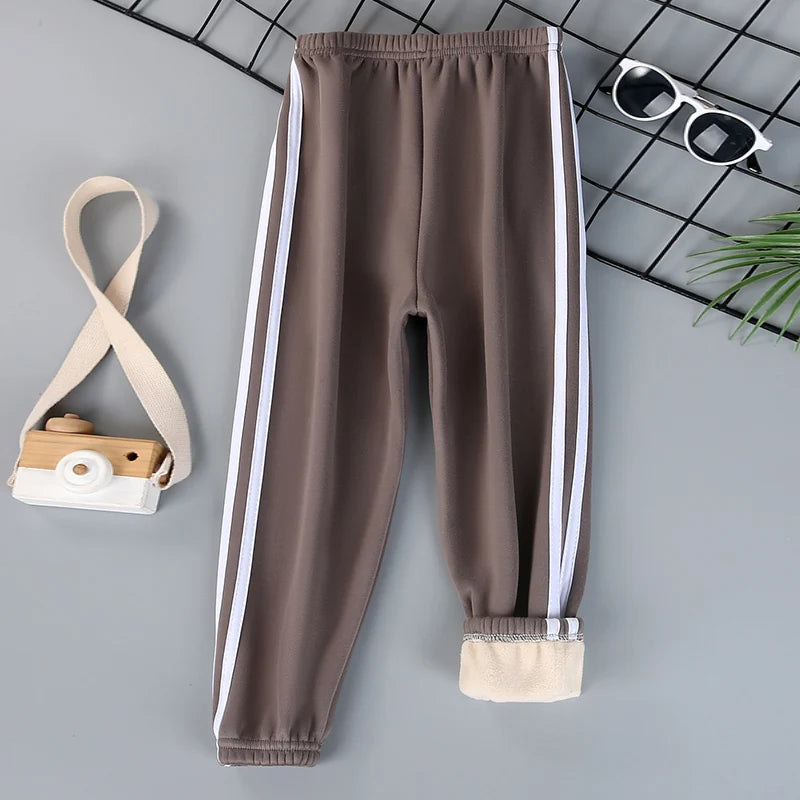 Autumn and winter children's solid color sports plus velvet pants boys and girls comfortable leisure warm sports fashion pants.
