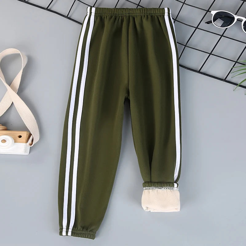 Autumn and winter children's solid color sports plus velvet pants boys and girls comfortable leisure warm sports fashion pants.